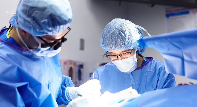 resident eye surgeons during a procedure